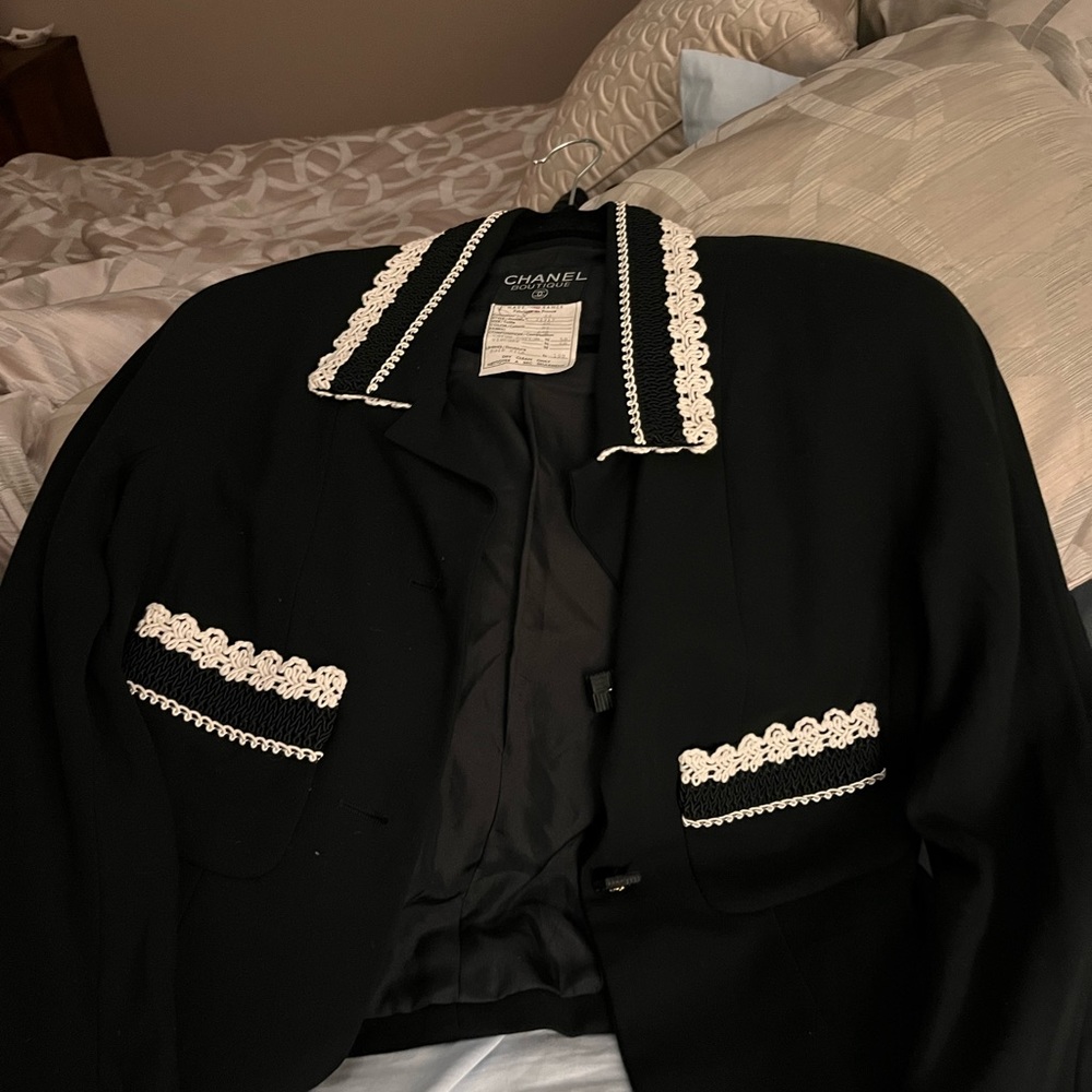 Chanel Boutique black Jacket with white crocheted trim.